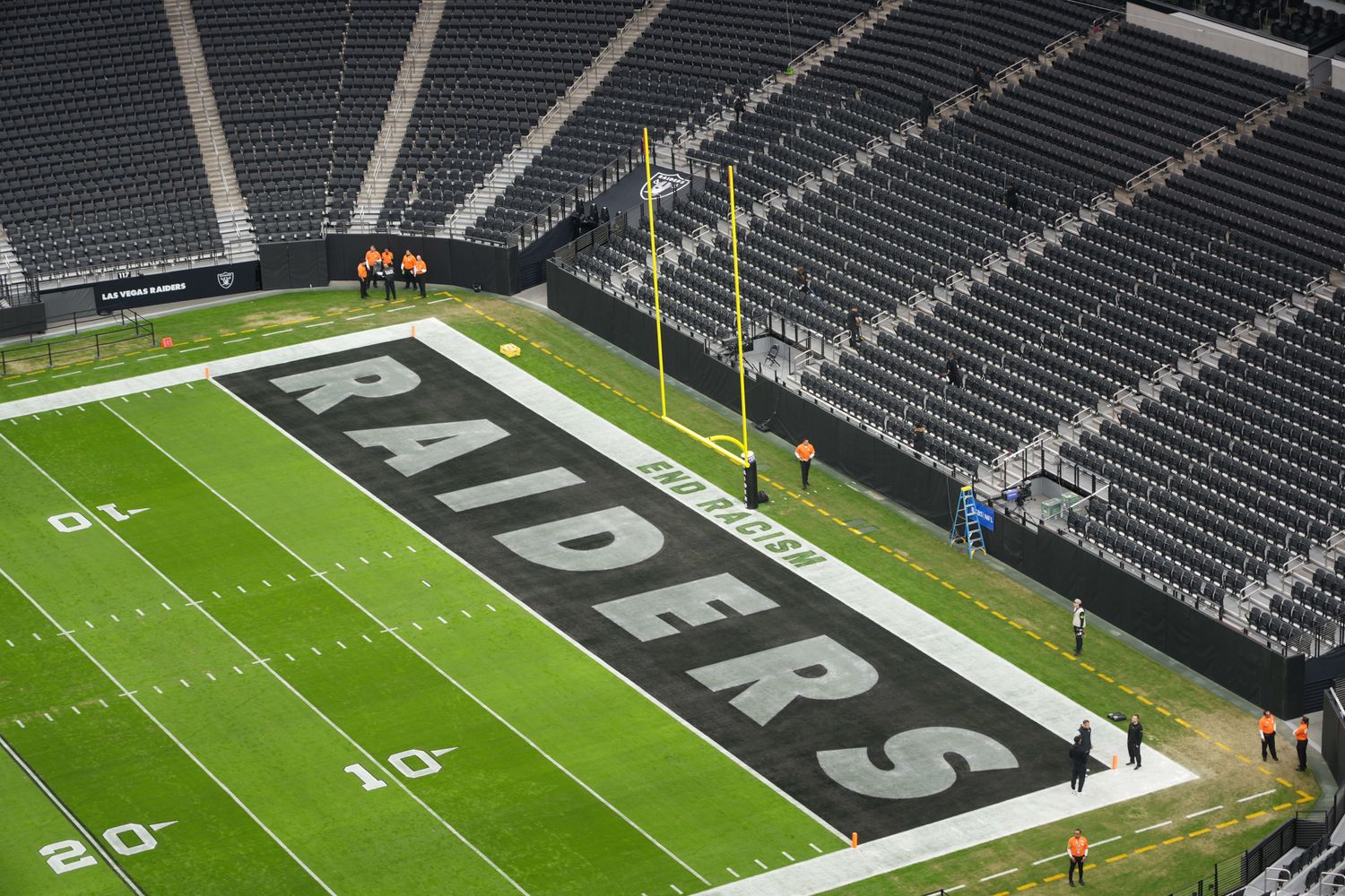 Nov 26, 2023; Paradise, Nevada, USA; The words End Racism and Raiders logo in the end zone at Allegiant Stadium. Mandatory Credit: Kirby Lee-USA TODAY Sports